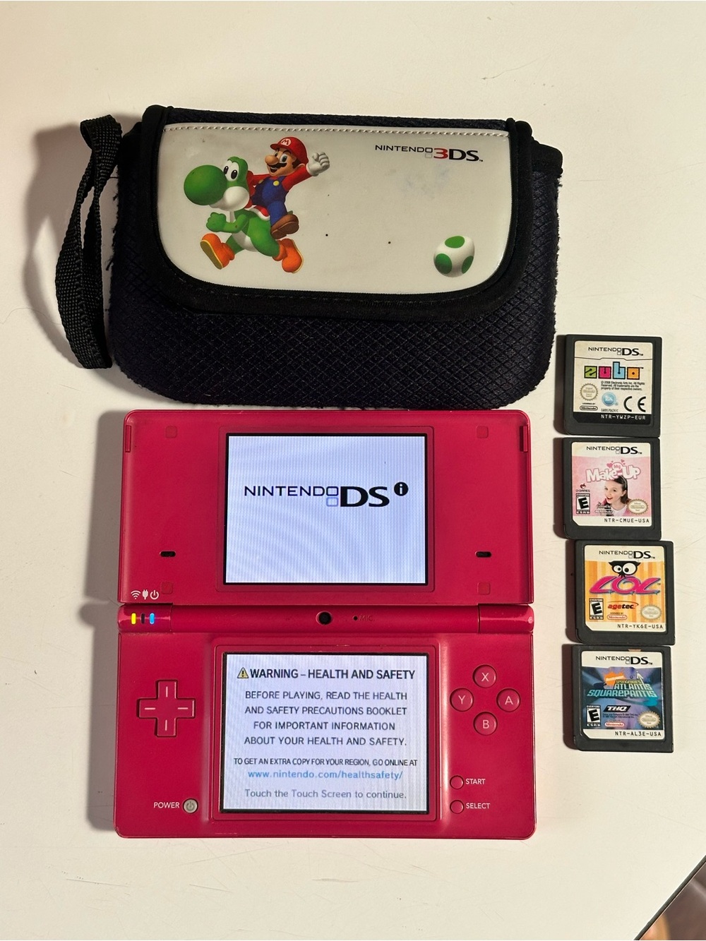 Nintendo Pink DSI Handheld Console with Carry Pouch and Games